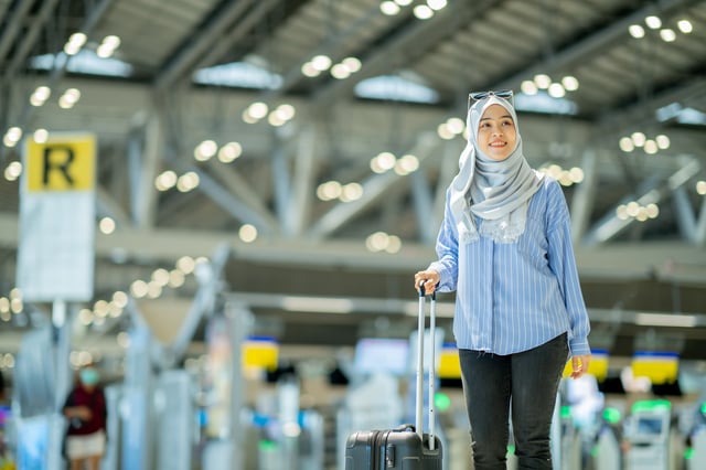 An Asian Muslim Wearing A Blue Hijab