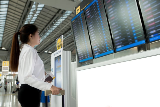 Asian Young Woman Information Board Checking