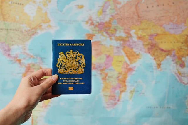 British Passport In Front Of A World Map