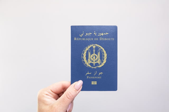 Close Up Of A Djibouti Passport Held In Hand