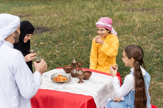 Happy Muslim Kids Holding Tea