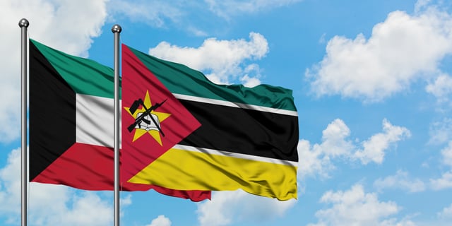 Kuwait And Mozambique Flag Waving In The Wind
