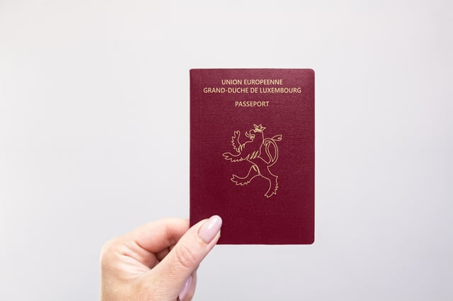Luxembourg Passport Held In Hand