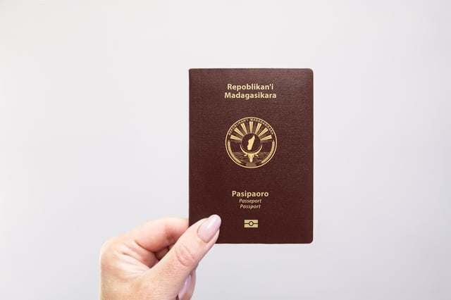 Madagascar Passport Held In Hand