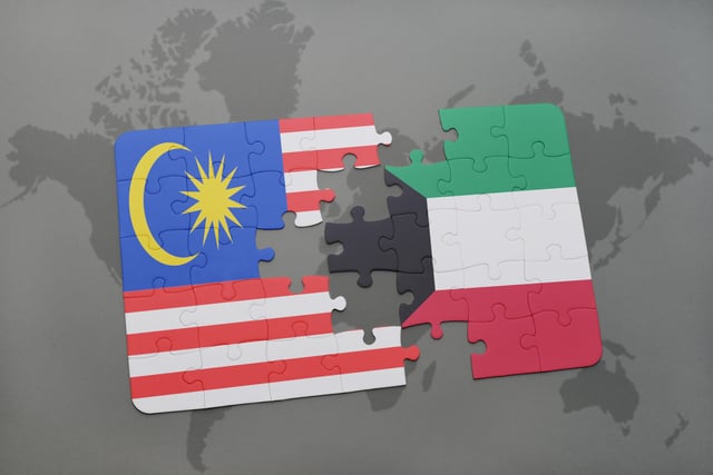 Puzzle With The National Flag Of Malaysia And Kuwait On A World Map Background