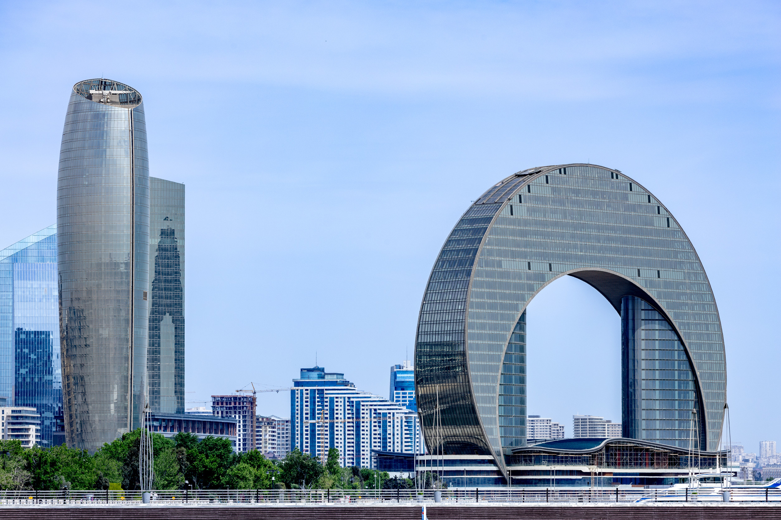 a city skyline with a large building in the middle baku azerbaijan