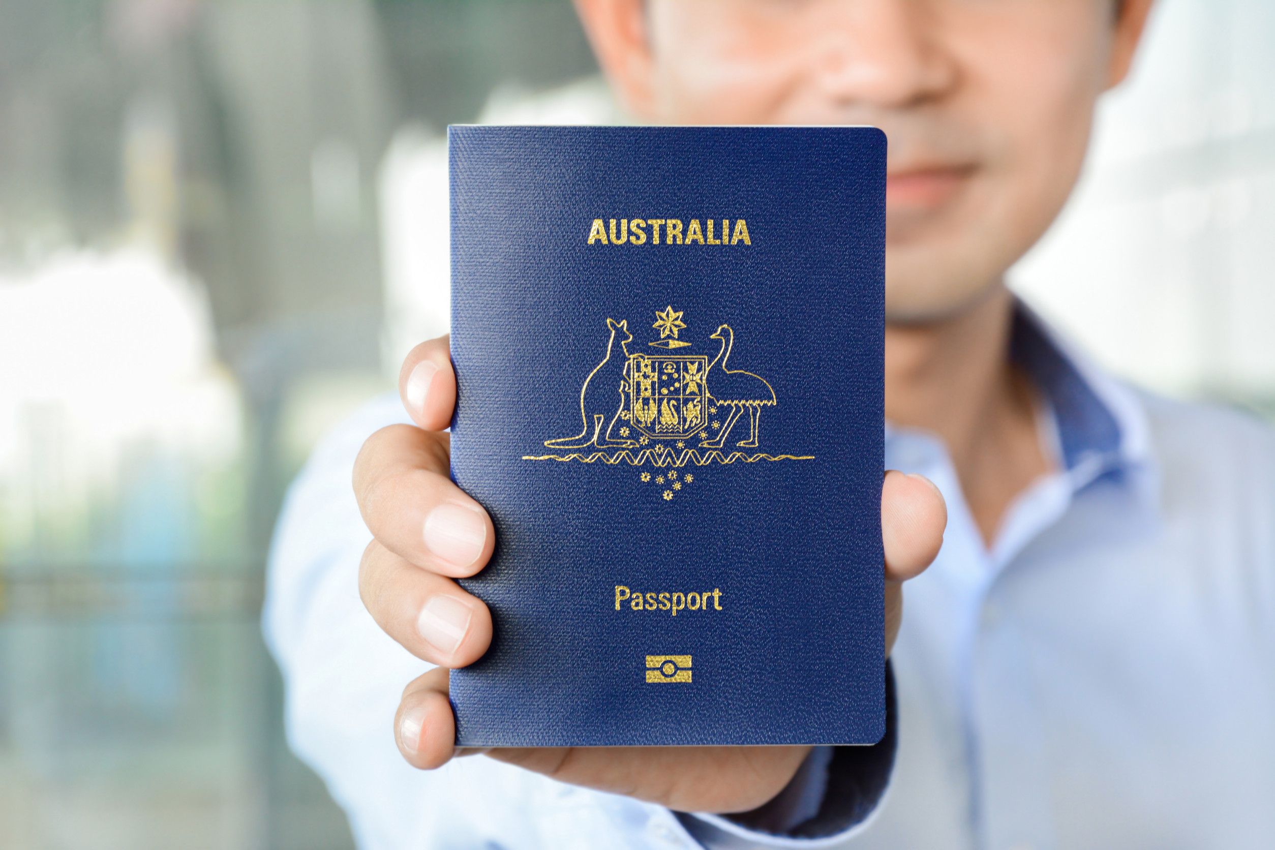 a-man-showing-passport-of-australia