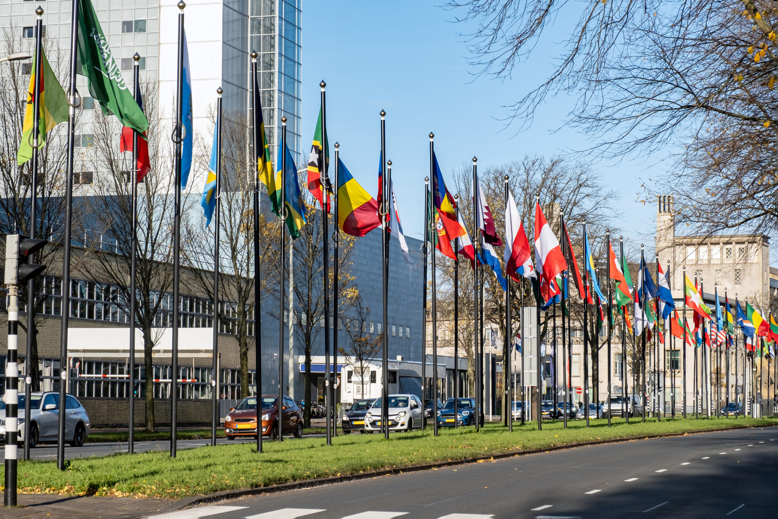 alley or a street with many flags of different countries parade of flags near the world forum in the