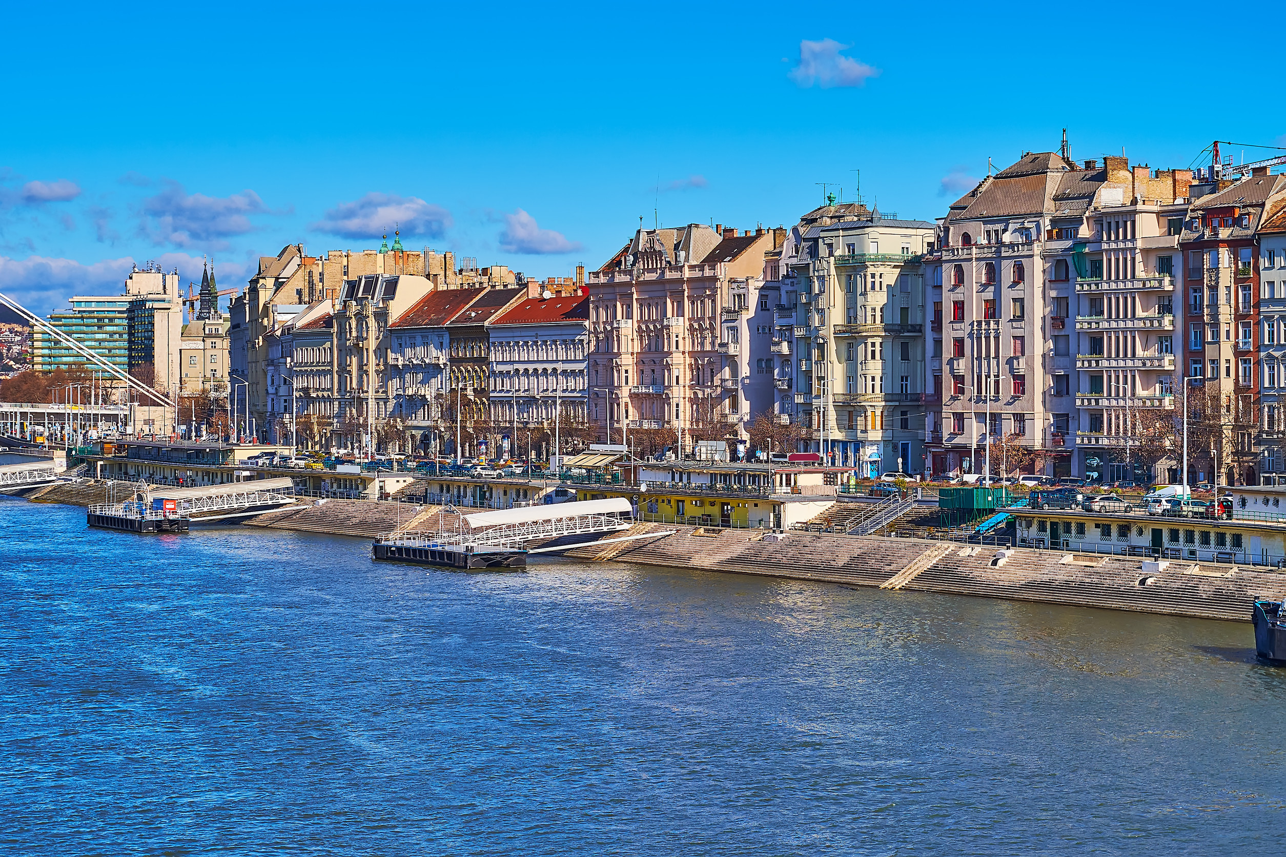 danube river embankment with line of historic townhouses of pest district budapest hungary