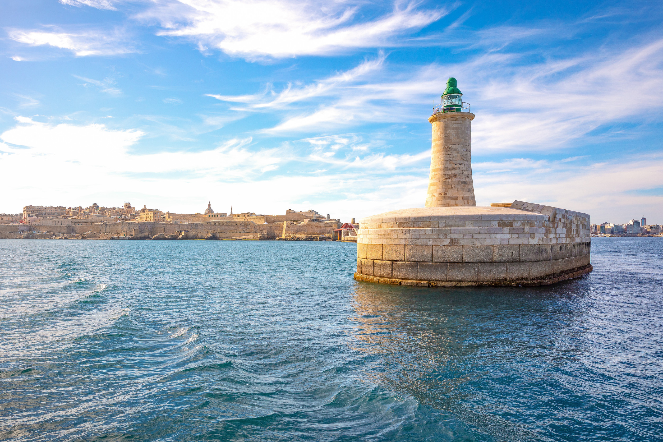 malta valletta view from the sea of the lighthouse of the st elmo fort