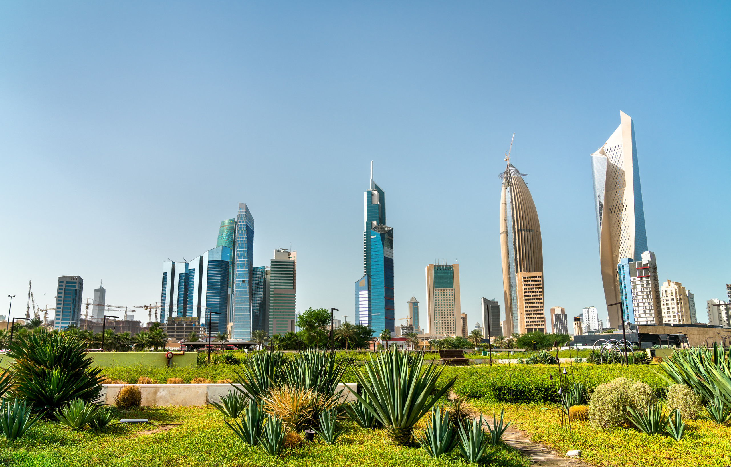 empty modern square and skyscrapers under sunbea