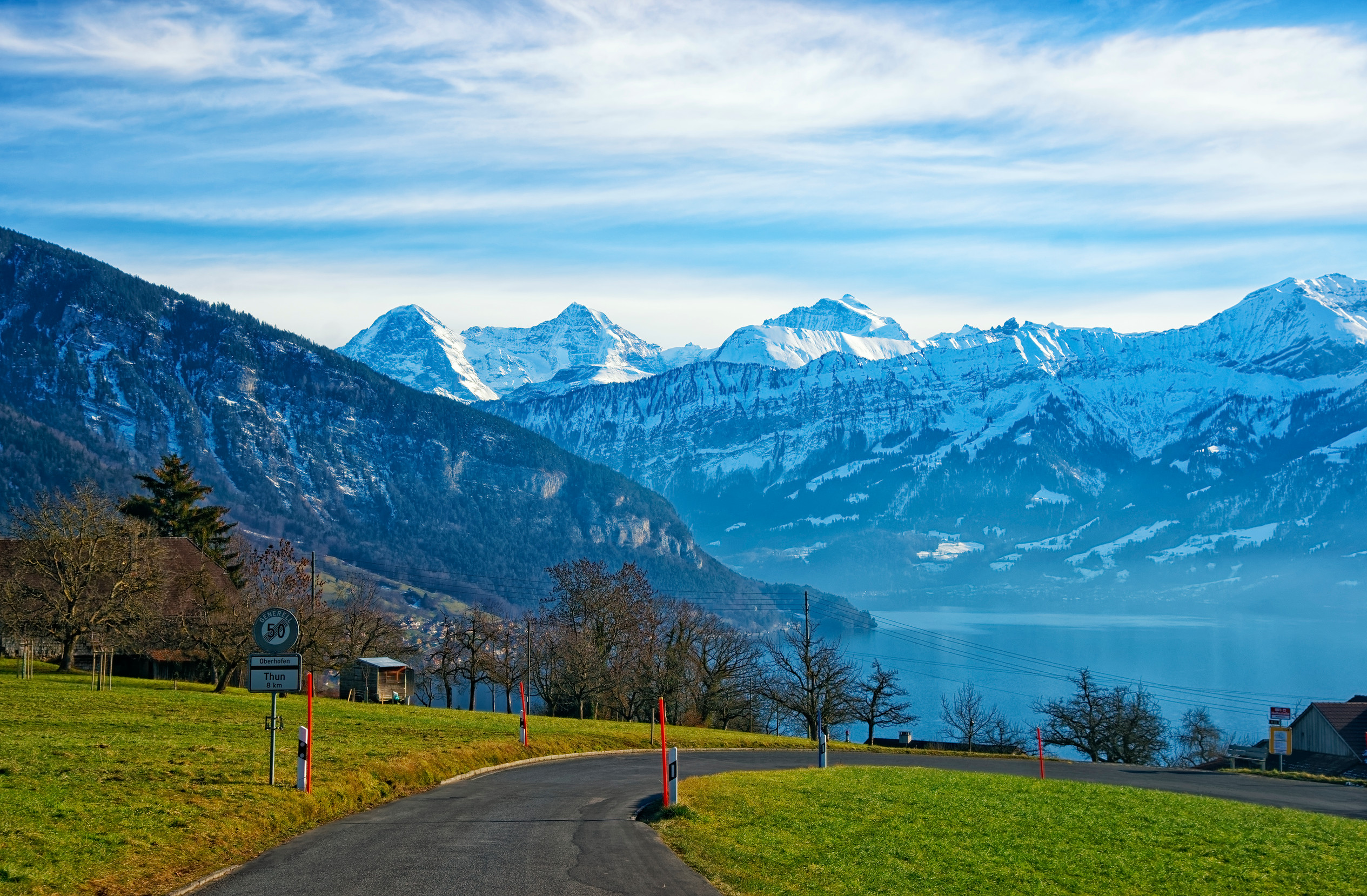 thun lake and jungfrau ridge peaks in bern highland view from oberhofen